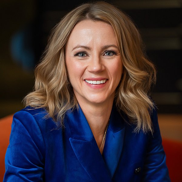 headshot of a woman in blue suit