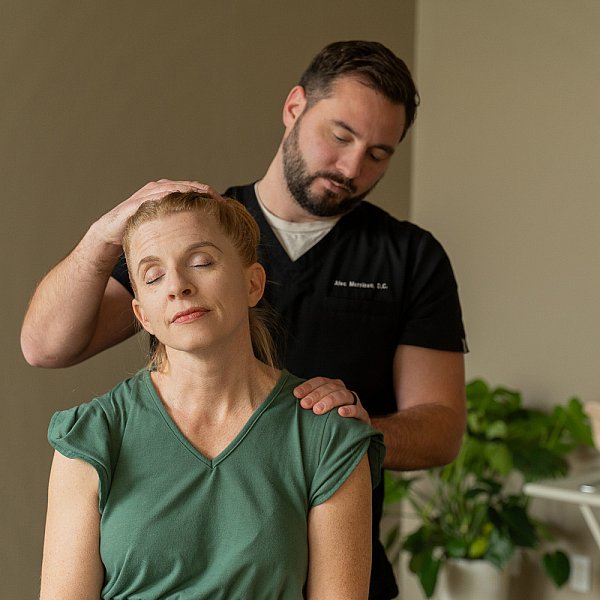 Photo of a chiropractor adjusting a patient in St. Louis. 